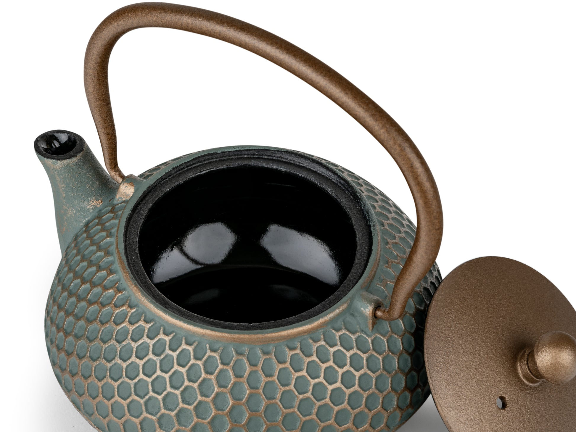 Teapot with textured surface and dark gold handle on a white background