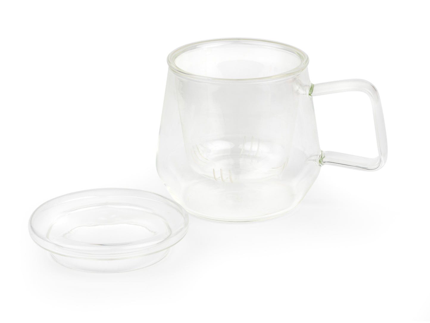 Clear glass mug with glass infuser and lid on a white background