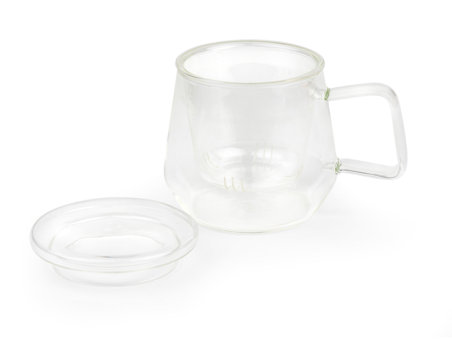 Clear glass mug with glass infuser and lid on a white background