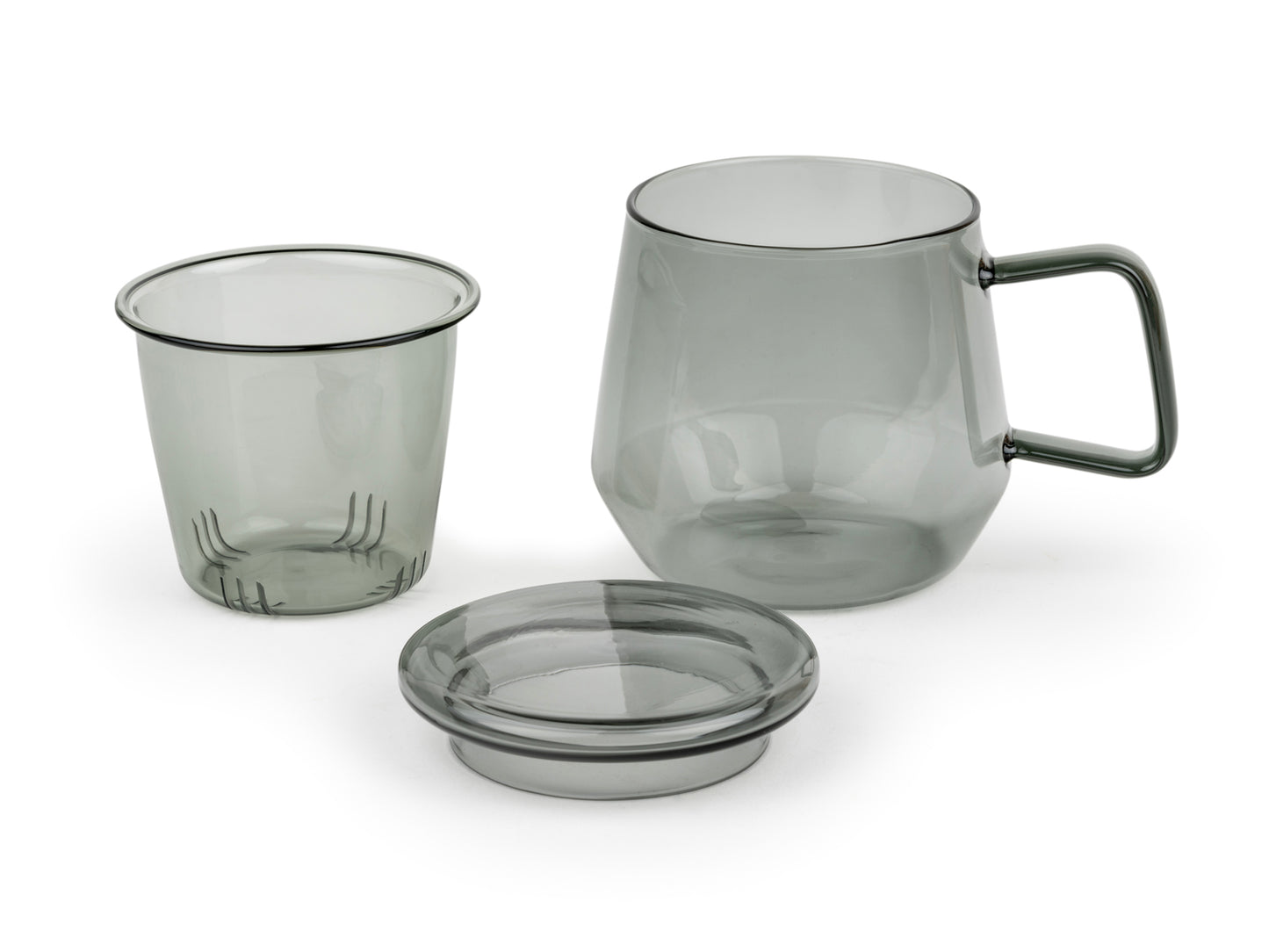 3 Piece glass mug in transparent smoky grey with handle. Glass infuser and lid are removed sitting on a white background.