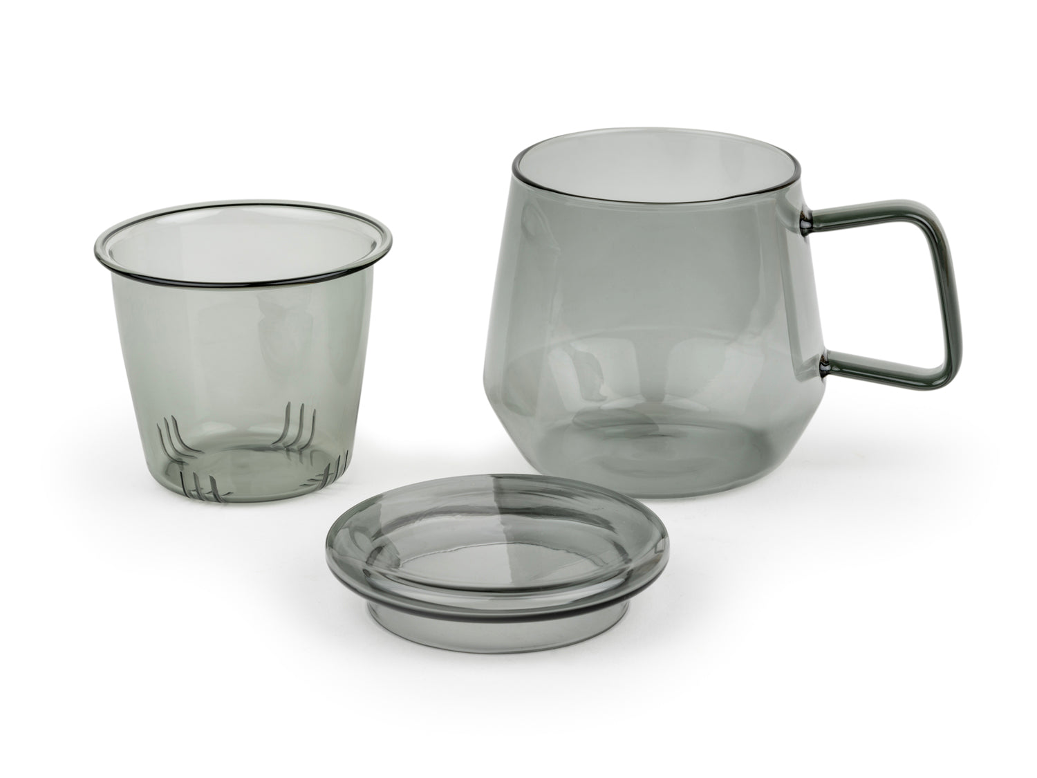 3 Piece glass mug in transparent smoky grey with handle. Glass infuser and lid are removed sitting on a white background.