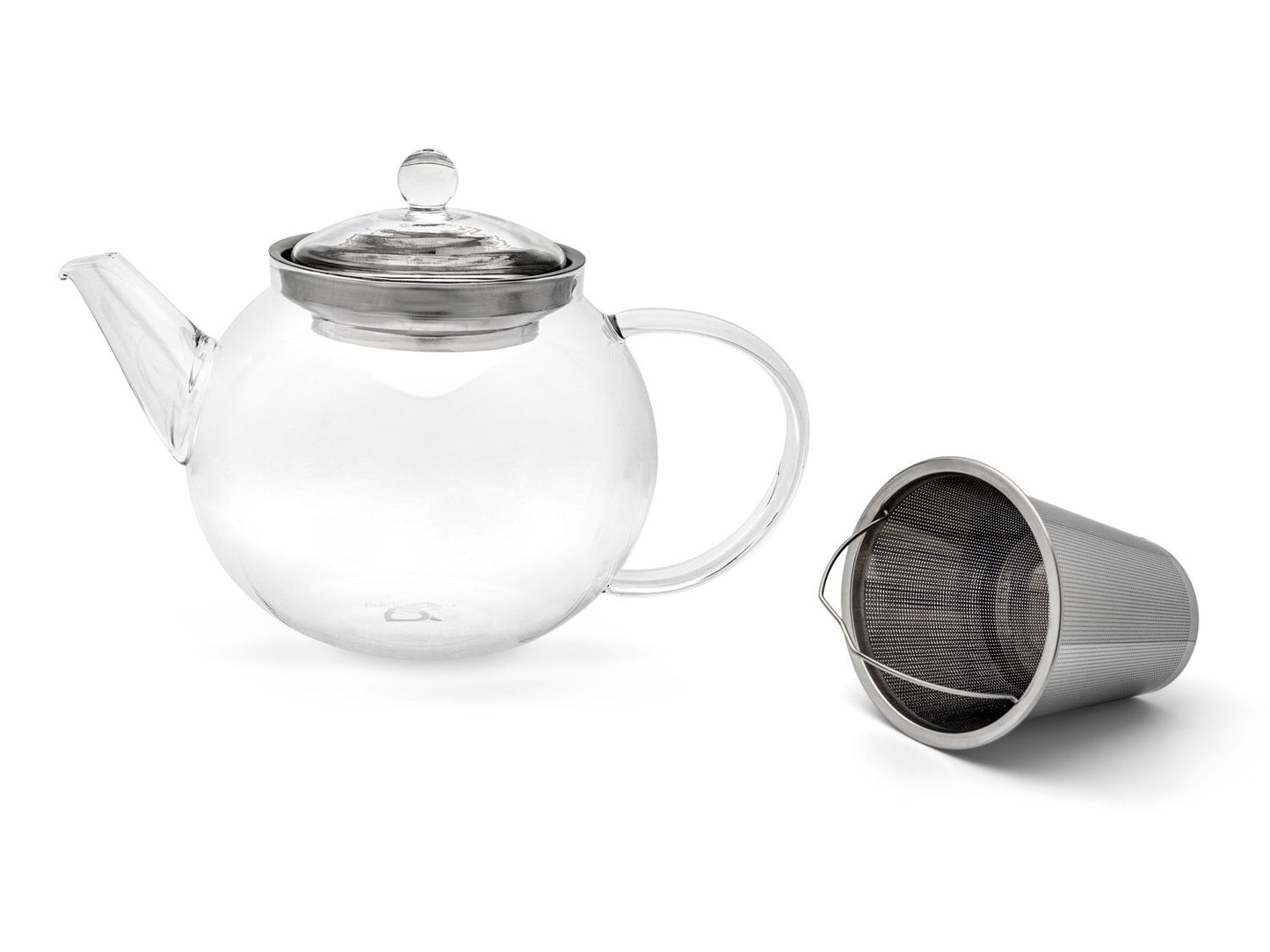 Curved clear glass teapot next to the removable stainless steel  filter on a white background