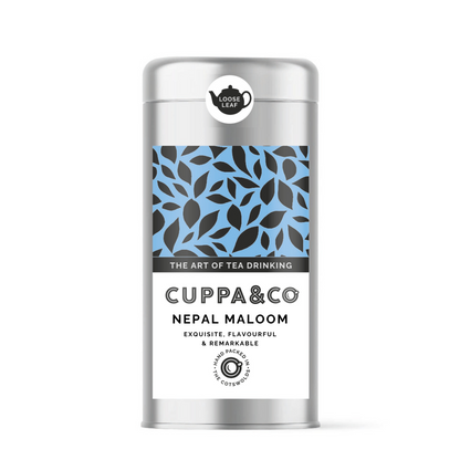 Packaged tea product 'Nepal Maloom' by Cuppa&Co in a silver caddy with a blue and black leaf patterned label.