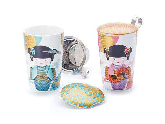 Two tea mugs with colorful designs and metal infusers on a white background 