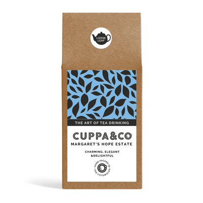 Packaged tea leaves product with brand name 'CUPPA & CO' and the name 'MARGARET’S HOPE ESTATE'. The package is a brown Kraft box with blue, black and white product label. 