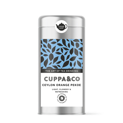 Silver caddy of Ceylon Orange Pekoe tea by Cuppa&Co with a blue and black leaf pattern on the front label.