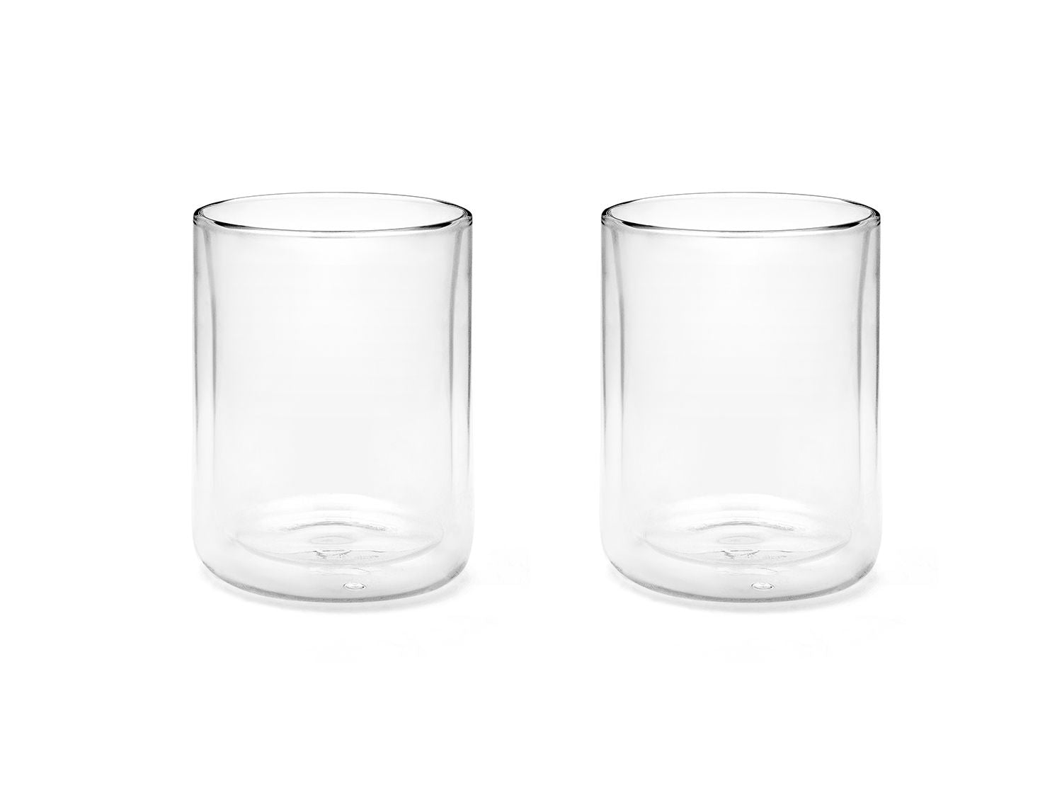 Two clear glass tumblers on a white background