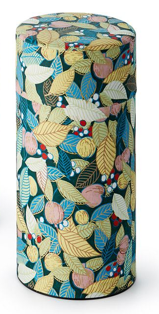 Cylindrical tea caddy with a colorful leaf pattern on a white background