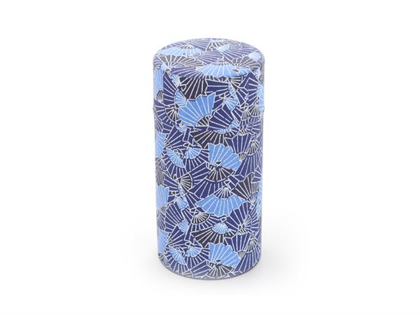 Cylindrical tea caddy with blue and black pattern on a white background
