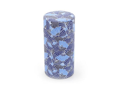 Cylindrical tea caddy with blue and black pattern on a white background