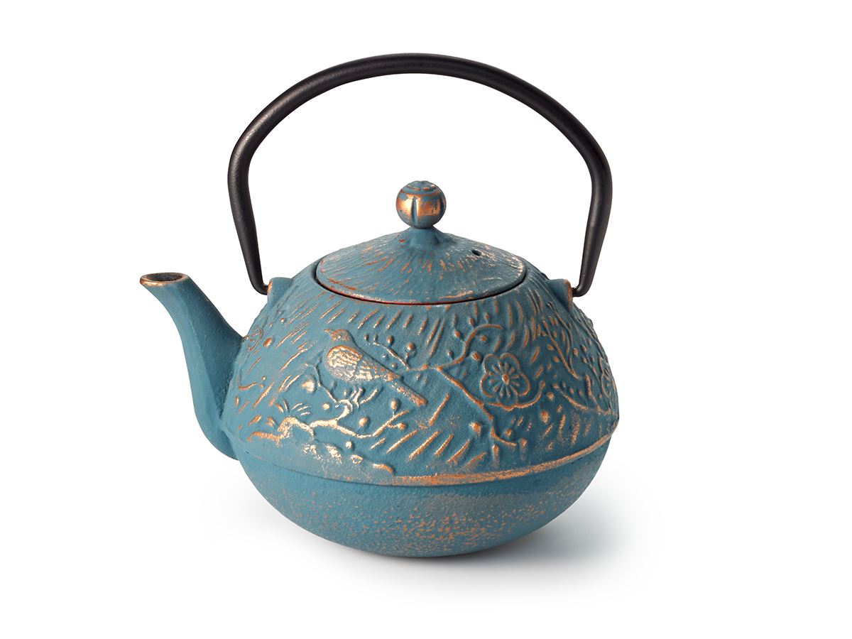 Blue and gold cast iron teapot with decorative relief pattern on a white background