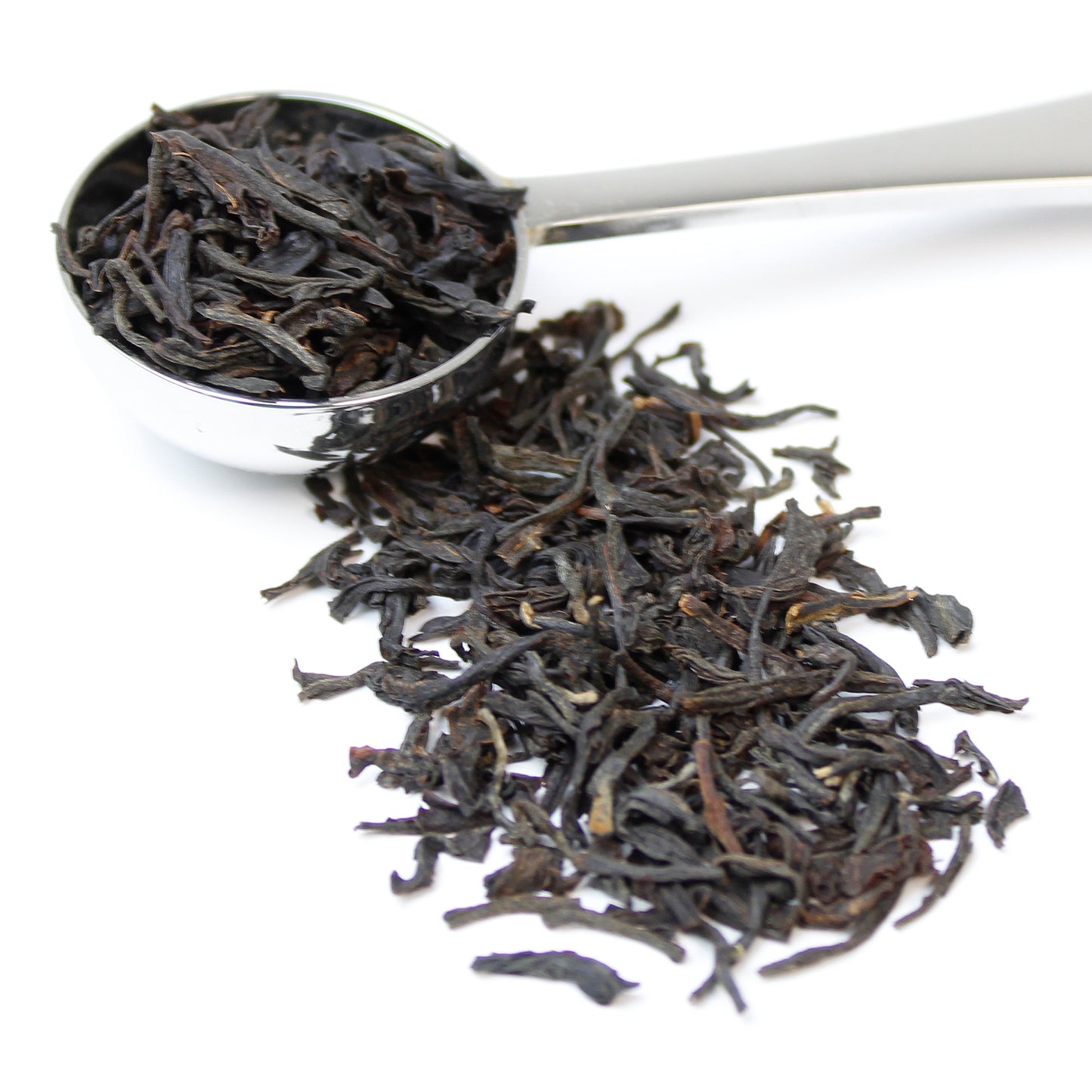 Cuppa & Co Indian Assam tea leaves pictured on a stainless steel teaspoon